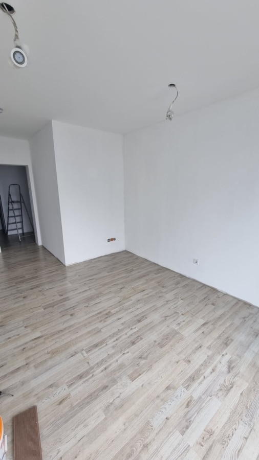 60m² Wohnung Wohnzimmer - Attraktives Doppelhaus mit 4 Wohneinheiten